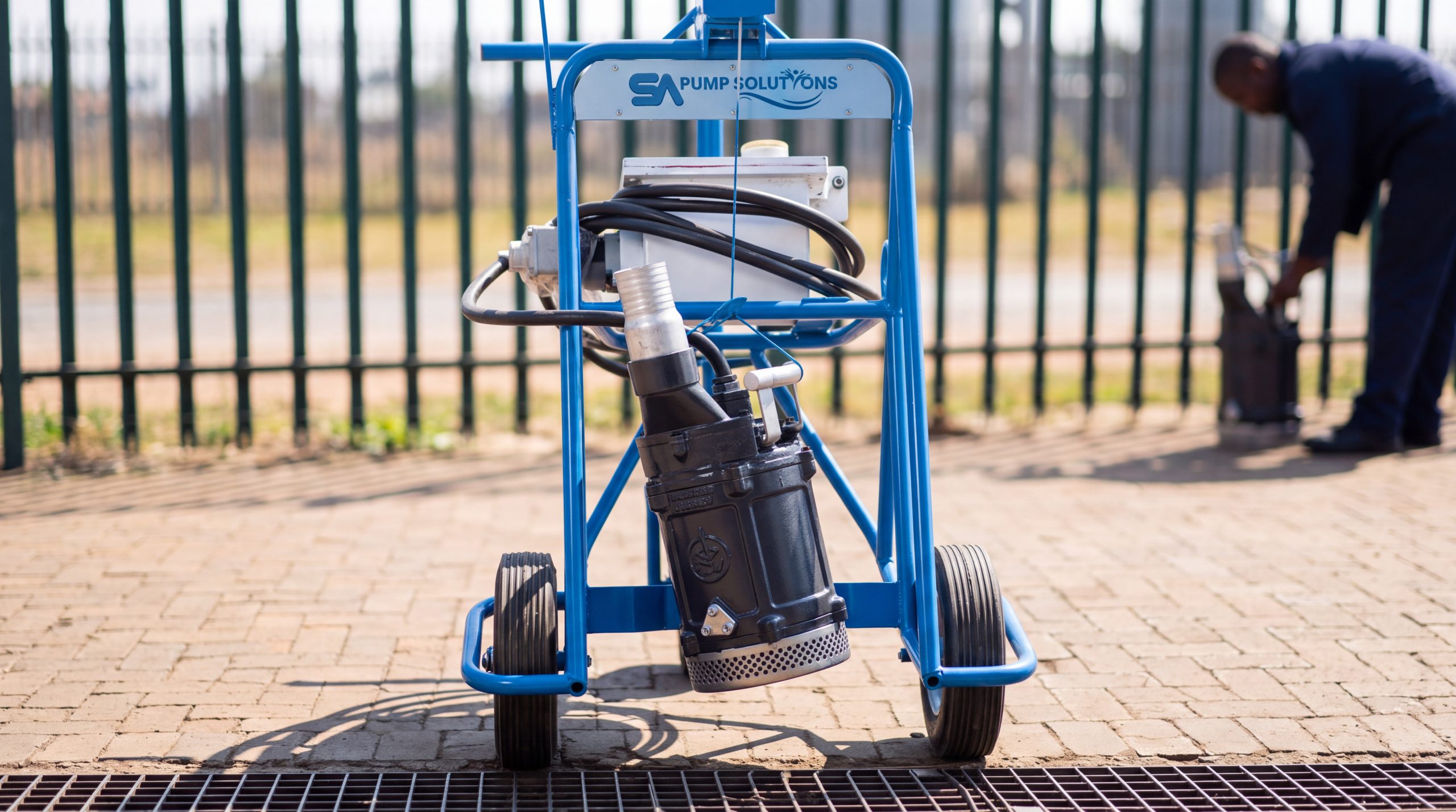 Portable submersible dewatering pump on a wheeled frame