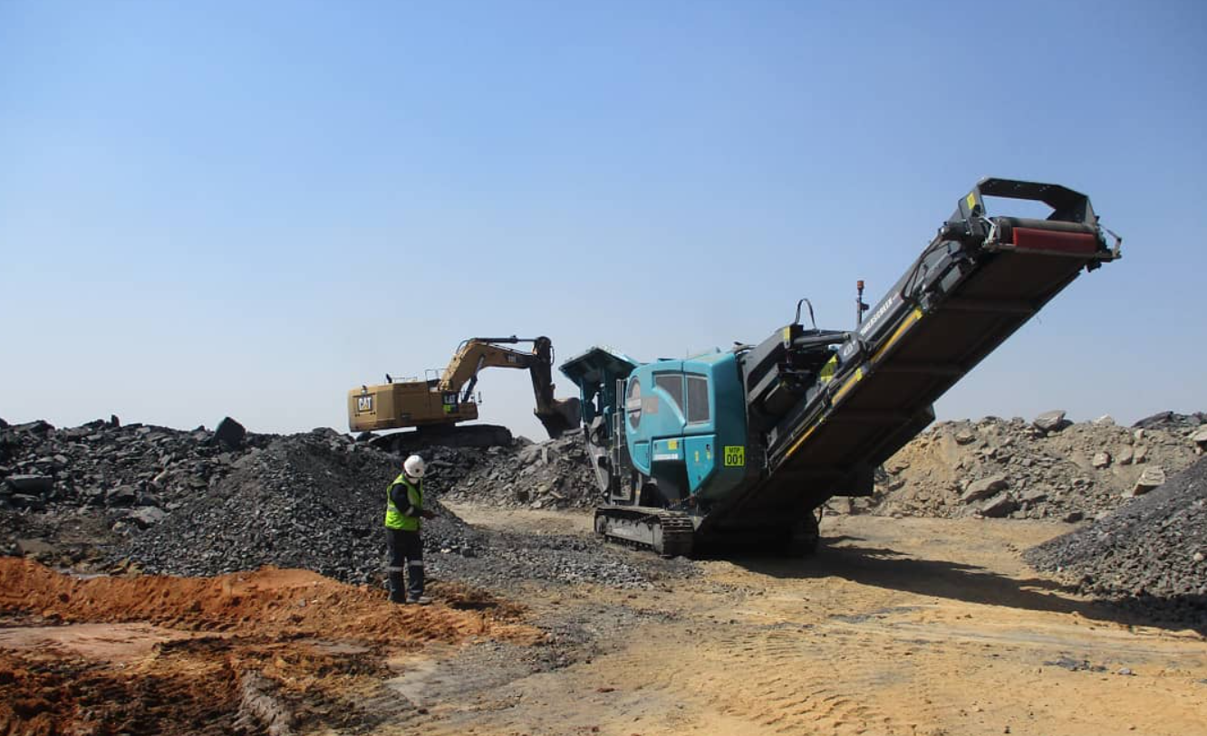 Crushing machinery and an excavator from Mphakama field photography